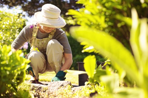 Gardeners working safely in a maintained outdoor space