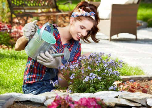 Seasonal pruning and shrub shaping during garden maintenance in Southfields