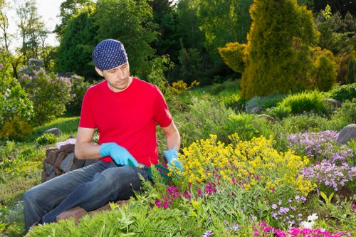 Hard landscaping features in a Southfields garden with paths and retaining edges